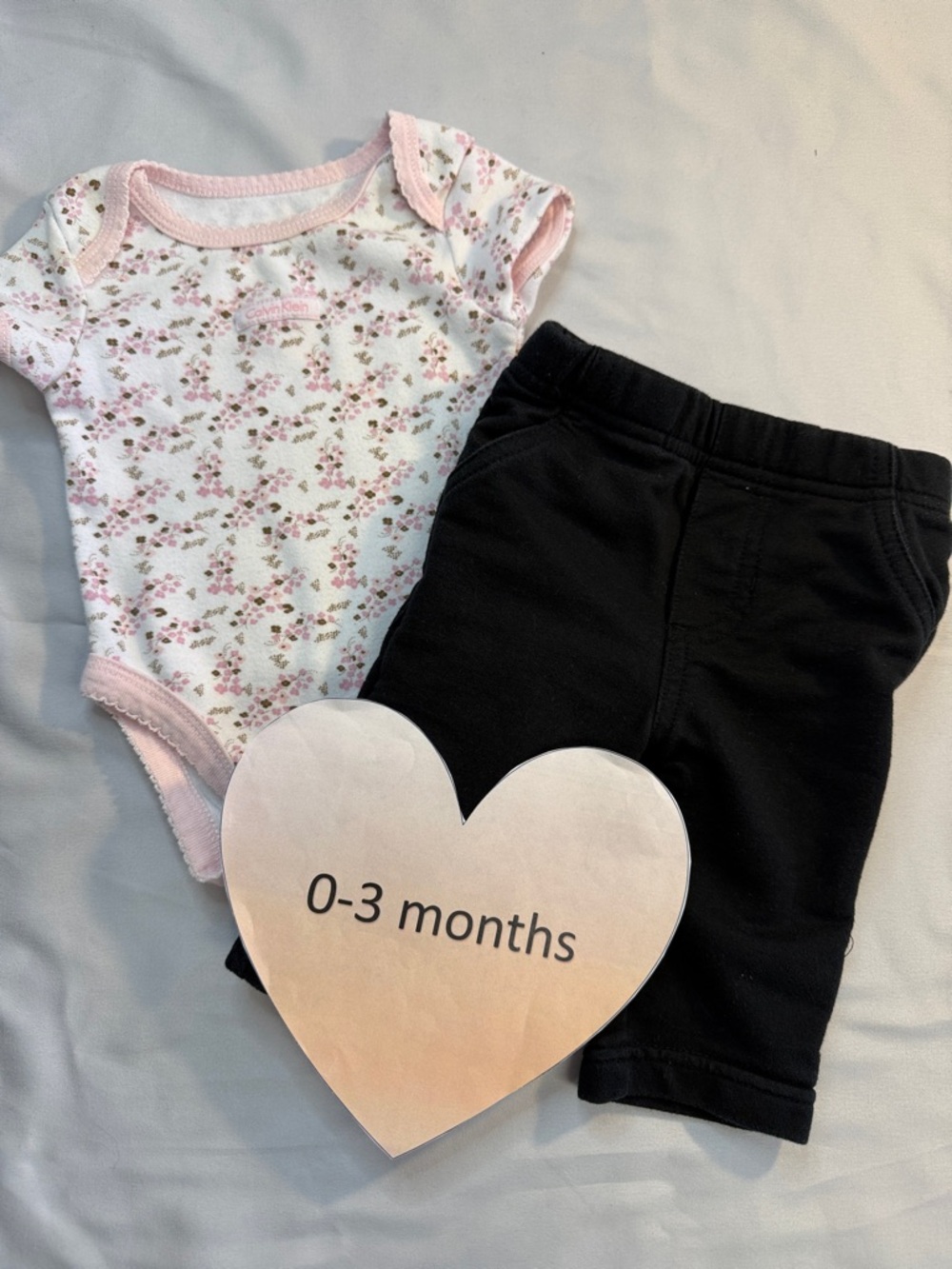 Calvin Klein - 2-piece outfit - Infant Onesie in Soft Pink and black pants